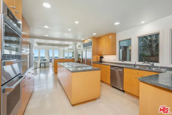 a view of a livingroom with furniture and a potted plant
