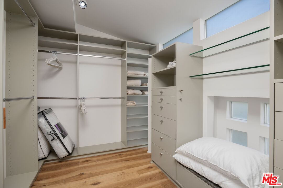 24456 Malibu Road Malibu, CA 90265 - Photo 16 of 33 a bedroom with a bed and a window