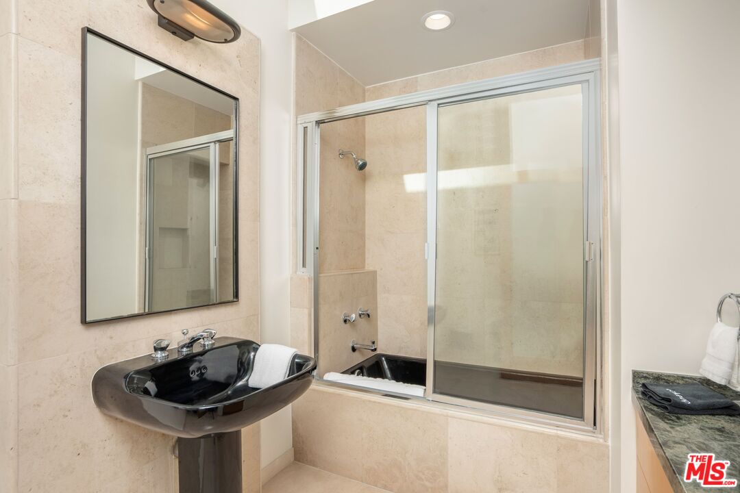 24456 Malibu Road Malibu, CA 90265 - Photo 21 of 33 a bathroom with a sink and a mirror