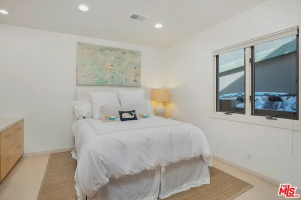 a view of a balcony with furniture and wooden floor