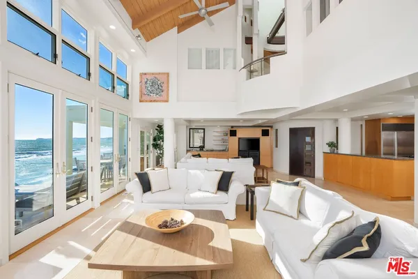 a view of a living room filled with furniture