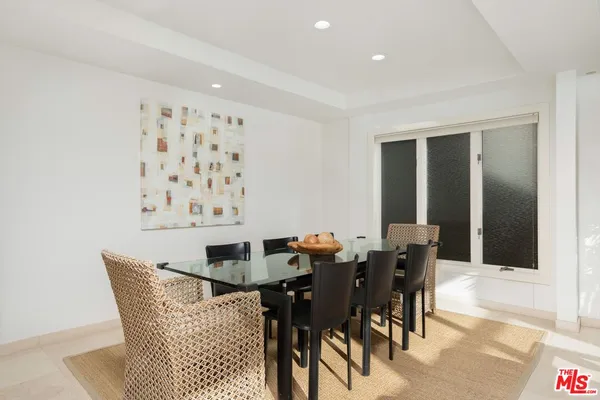 a kitchen with stainless steel appliances granite countertop sink stove and refrigerator