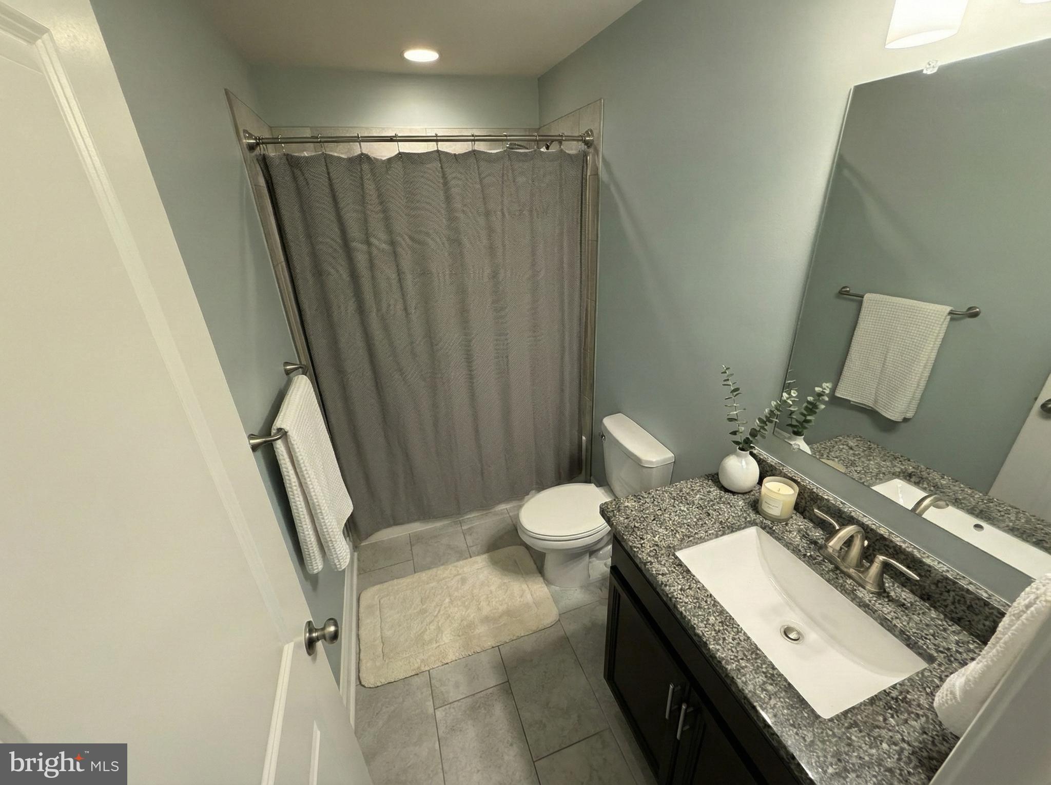 2015 Margrave Avenue Fallston, MD 21047 - Photo 15 of 20 a bathroom with a granite countertop sink toilet and shower
