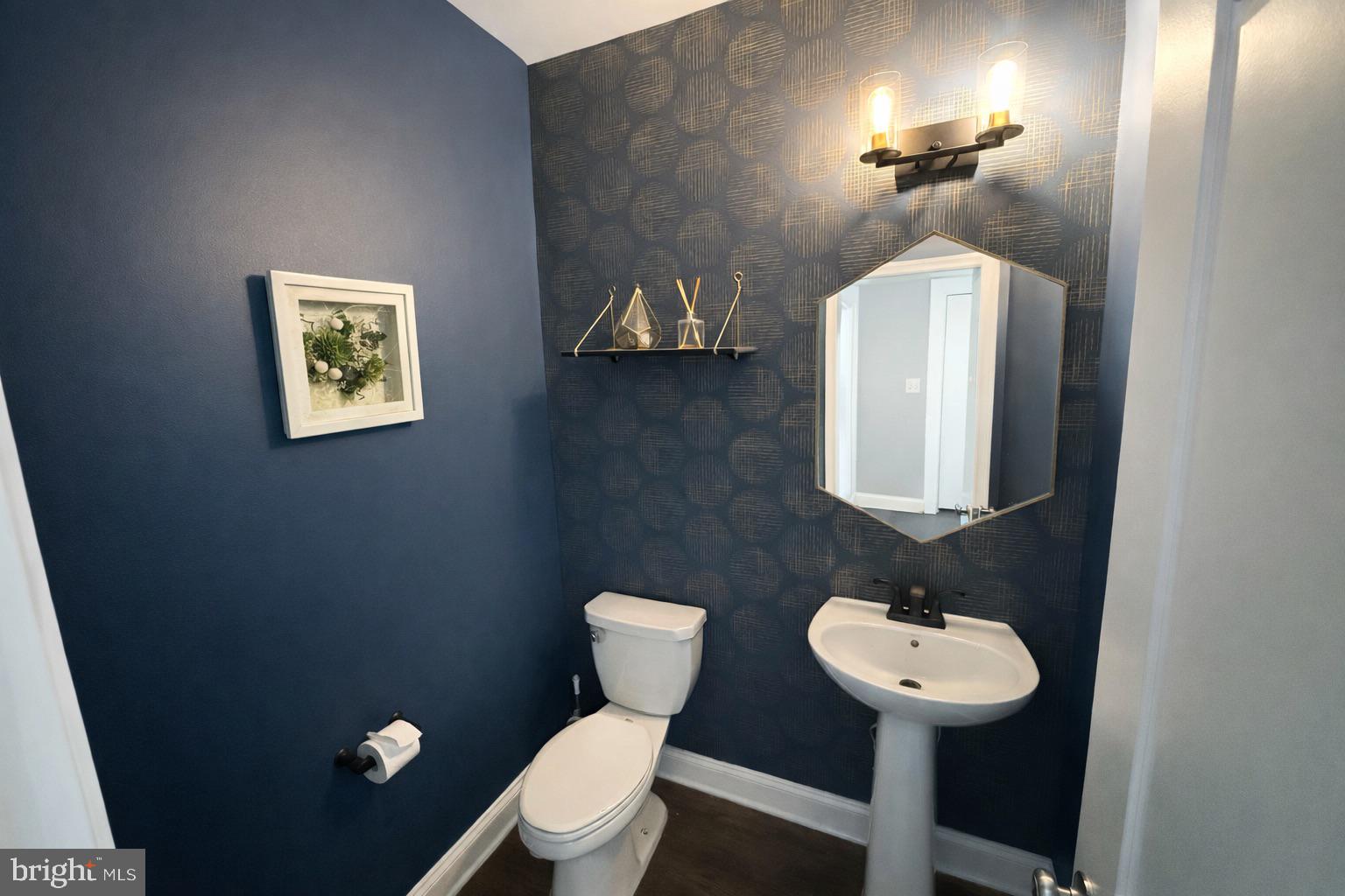 2015 Margrave Avenue Fallston, MD 21047 - Photo 19 of 20 a bathroom with a toilet a sink and mirror