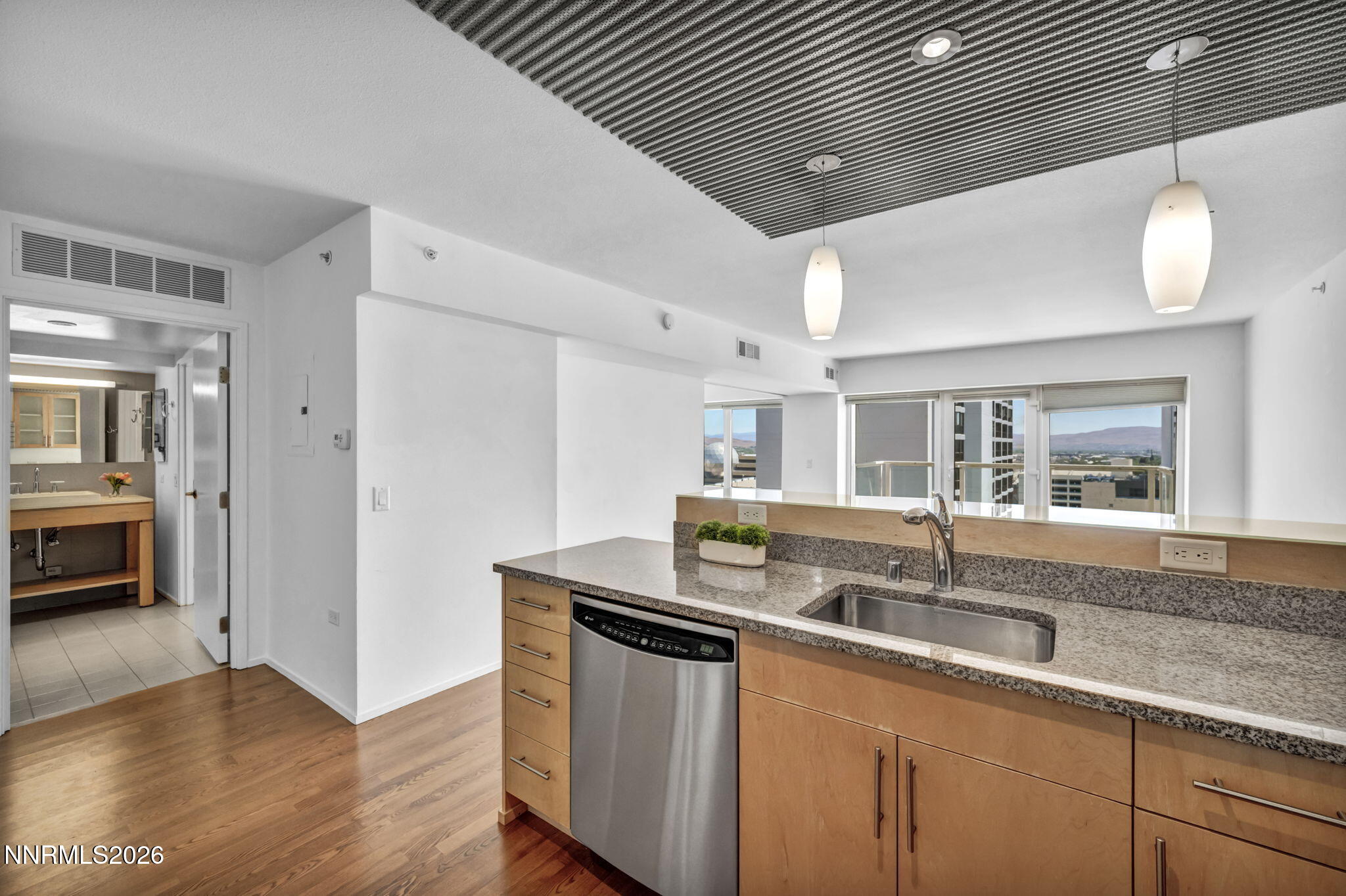 255 North Sierra Street, Unit 1208 Reno, NV 89501 - Photo 11 of 37 a kitchen with granite countertop a sink and a counter top space