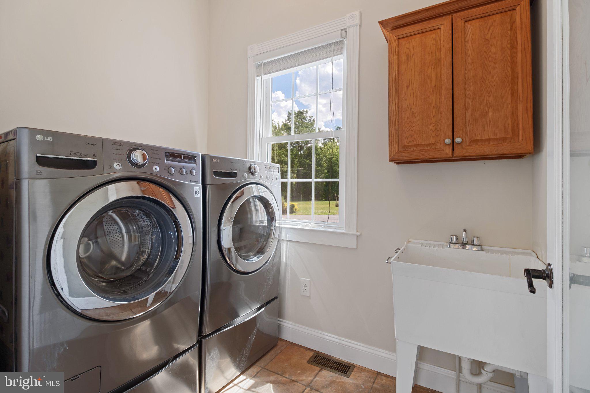 7147 Linganore Road New Market, MD 21774 - Photo 15 of 44 Bright laundry room with modern appliances.