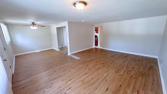 a kitchen with a refrigerator a stove top oven a sink and cabinets