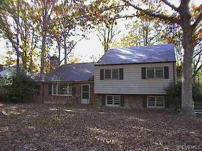 220 Ralston Road Richmond, VA 23229 - Photo 1 of 1 a front view of a house with a garden