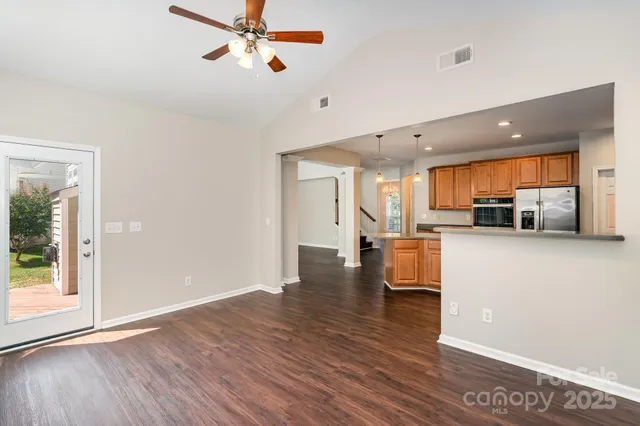 a view of kitchen with furniture and wooden floor