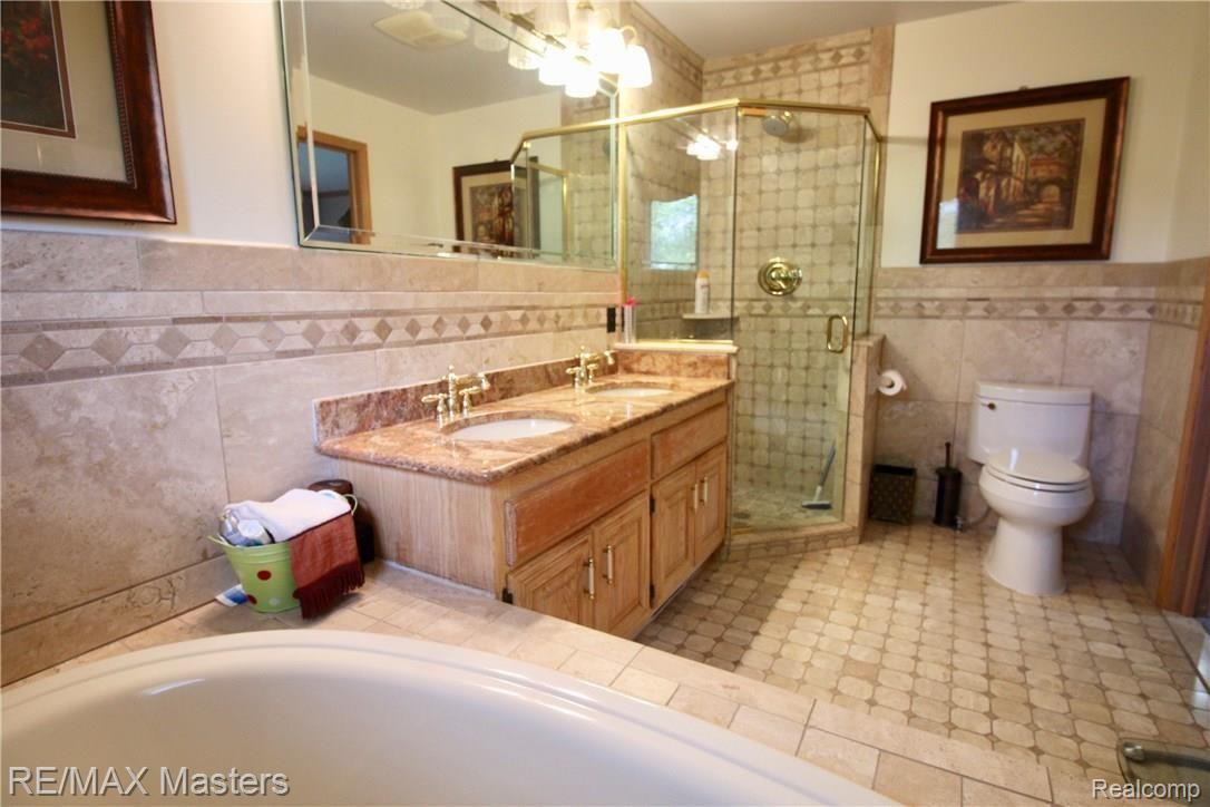 26454 Rinne Road New Boston, MI 48164 - Photo 16 of 41 There's plenty of room for the busy family to get out the door on time with separate fixtures for each person