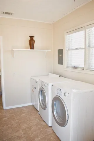 a utility room with dryer and washer