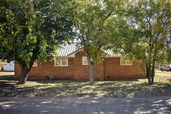 a pathway of a house with a yard