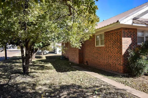 a front view of a house with a large window