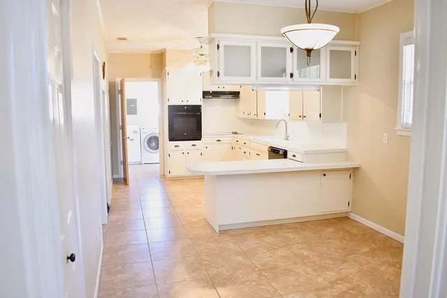 a bathroom with a sink a mirror and shower