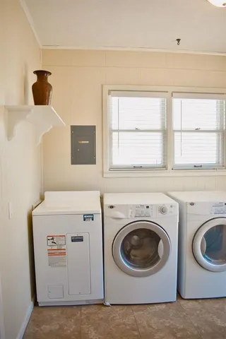 a utility room with dryer and washer