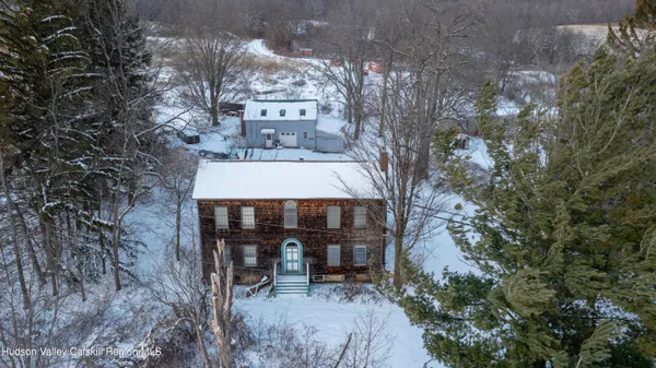 a view of a patio with table and chairs and potted plants
