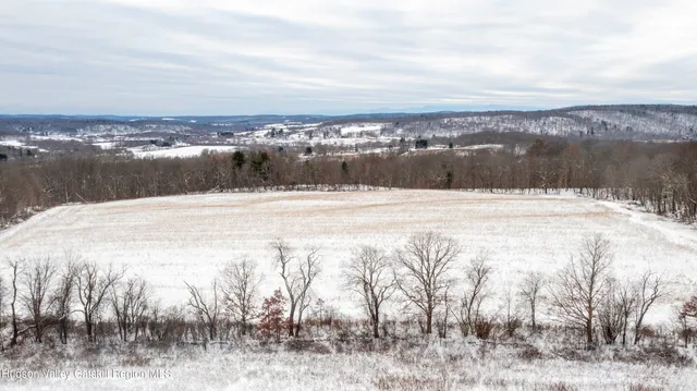 a view of a lake with mountains in the background