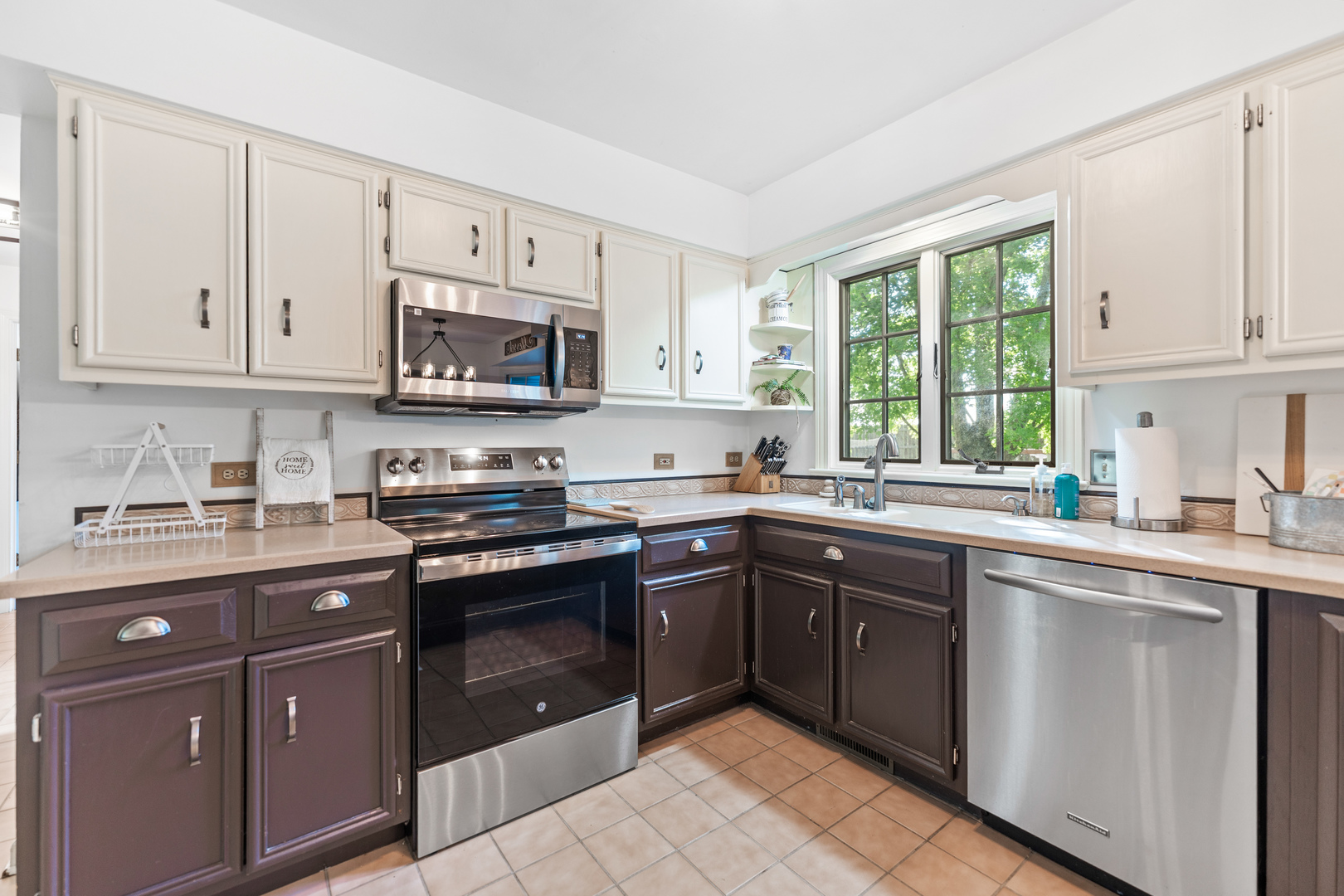 560 Renee Court Geneva, IL 60134 - Photo 17 of 50 a kitchen with stainless steel appliances granite countertop a stove sink and cabinets
