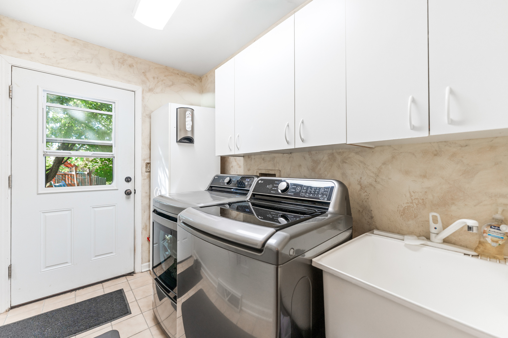 560 Renee Court Geneva, IL 60134 - Photo 24 of 50 a kitchen with a stove and a white cabinet