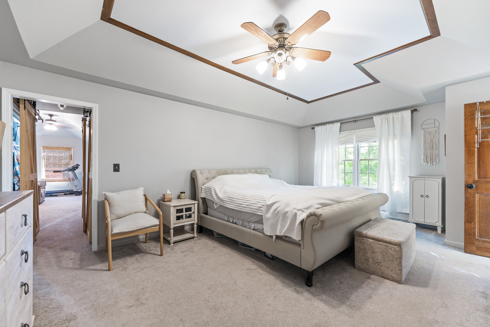 560 Renee Court Geneva, IL 60134 - Photo 26 of 50 a spacious bedroom with a bed painting on wall and a large window