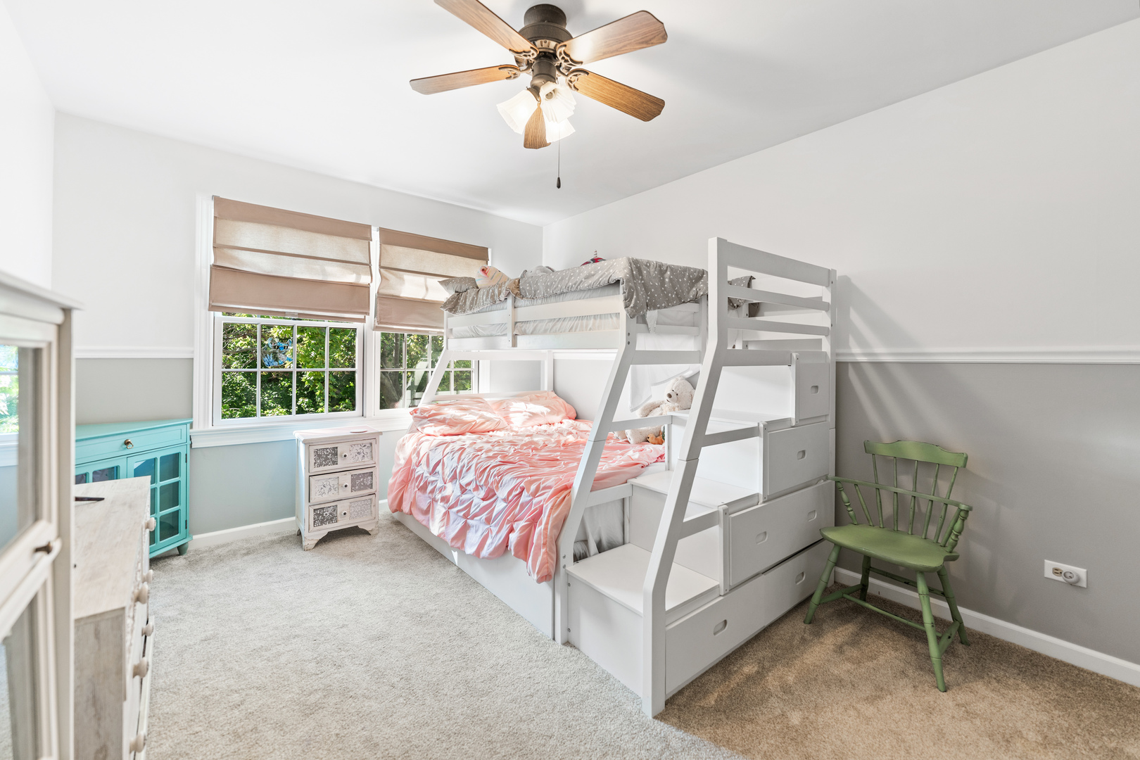 560 Renee Court Geneva, IL 60134 - Photo 34 of 50 a bedroom with a bed and a chandelier