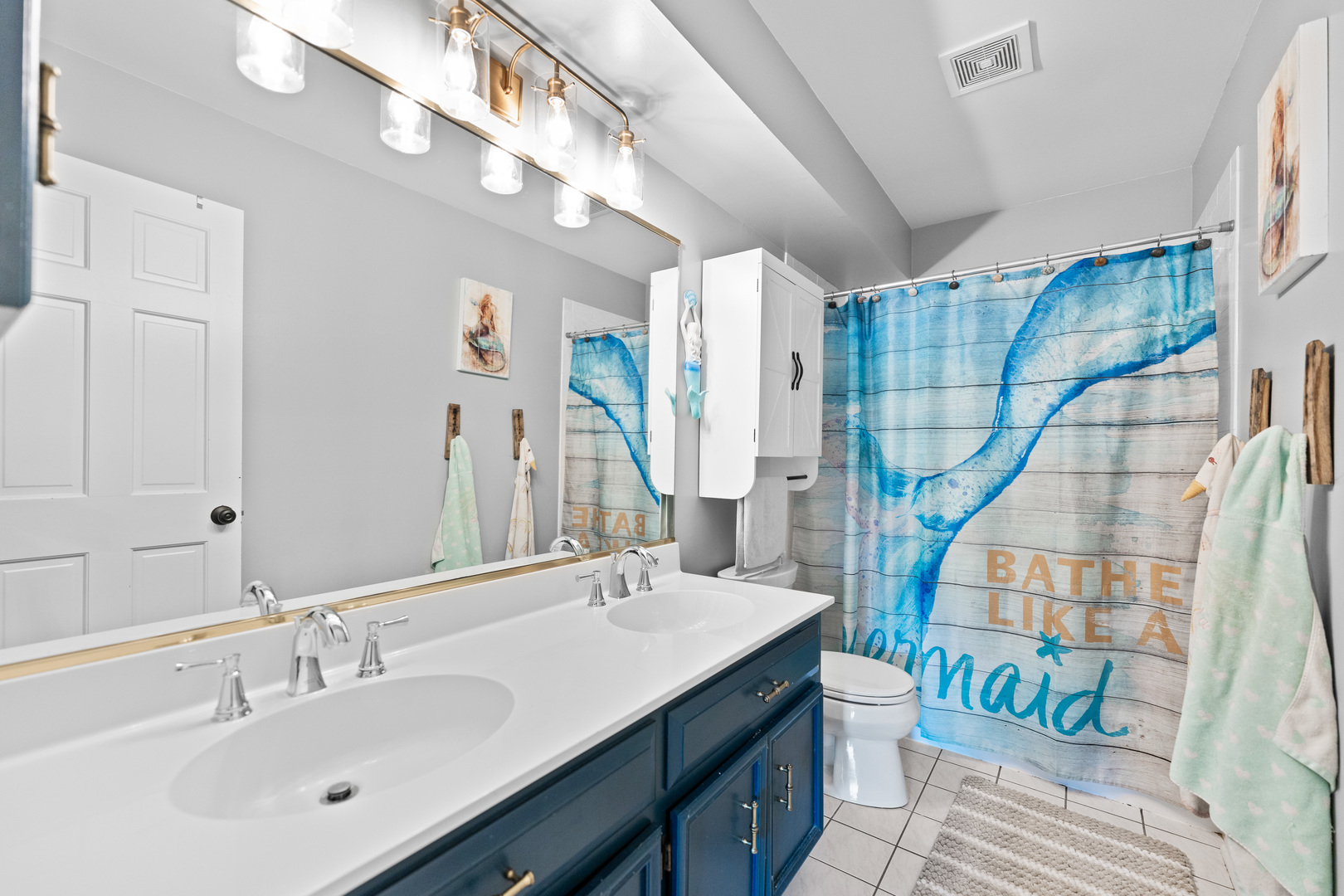 560 Renee Court Geneva, IL 60134 - Photo 35 of 50 a bathroom with double vanity sink and a mirror