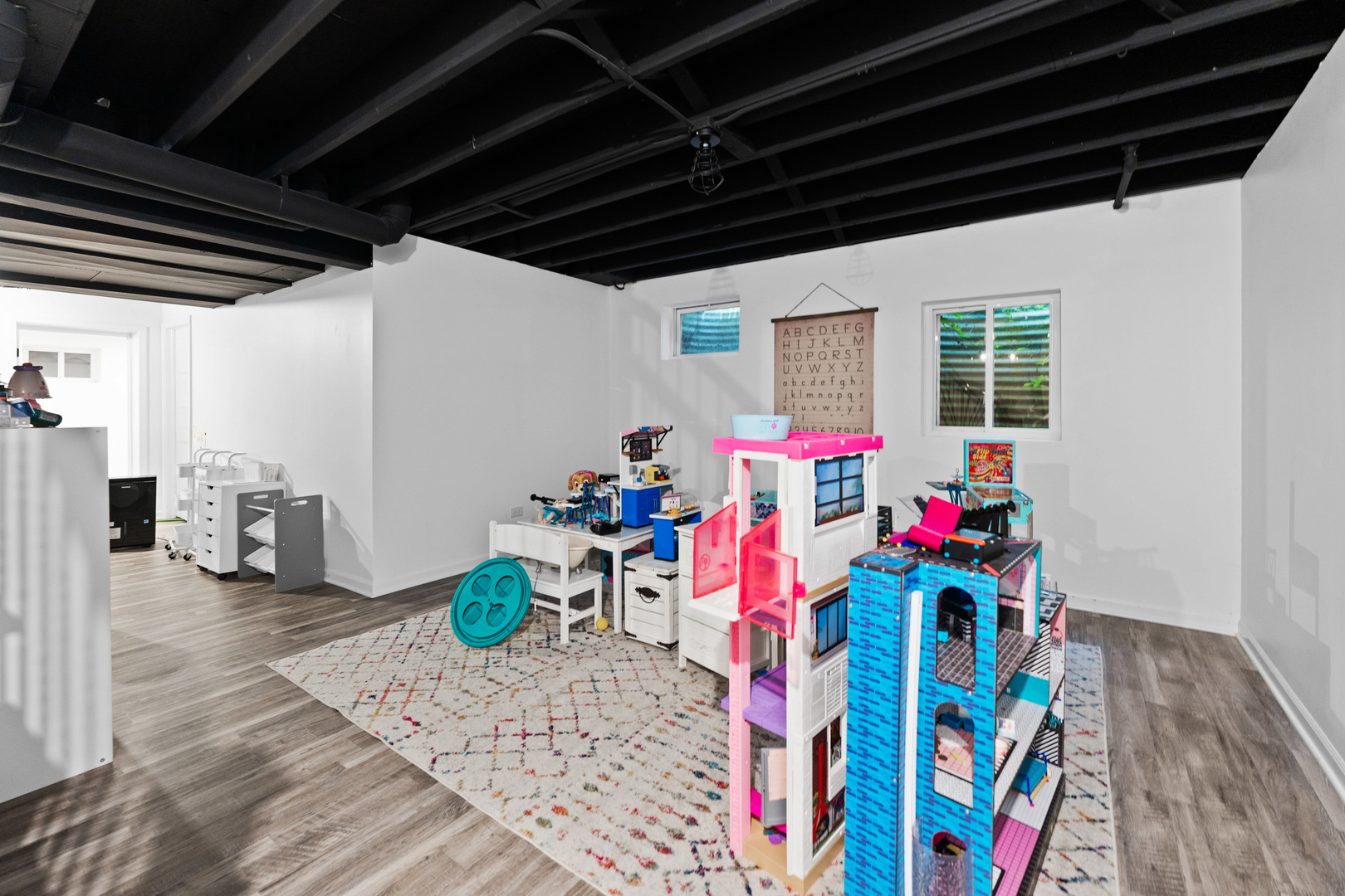 560 Renee Court Geneva, IL 60134 - Photo 39 of 50 a very nice looking room with wooden floor and furniture