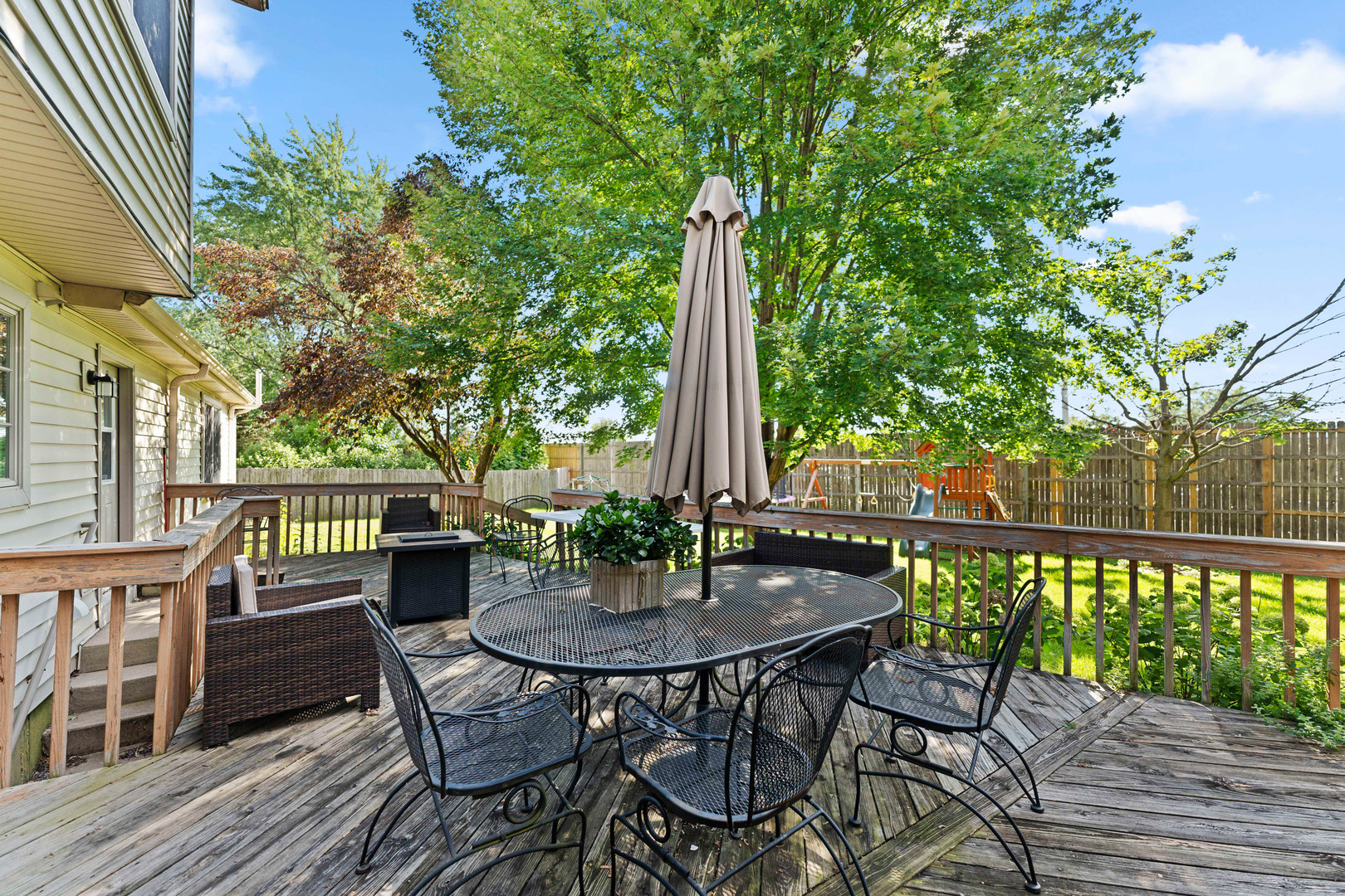 560 Renee Court Geneva, IL 60134 - Photo 41 of 50 a view of a patio with a table chairs and a table