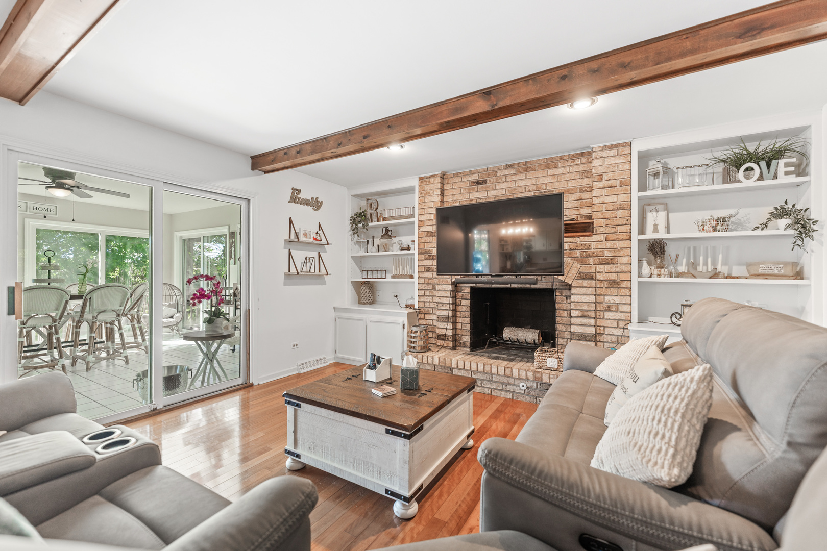 560 Renee Court Geneva, IL 60134 - Photo 10 of 50 a living room with furniture and a fireplace