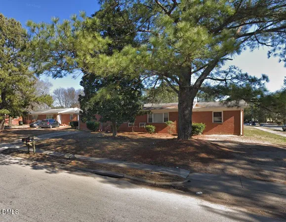 a tree in the middle of a yard