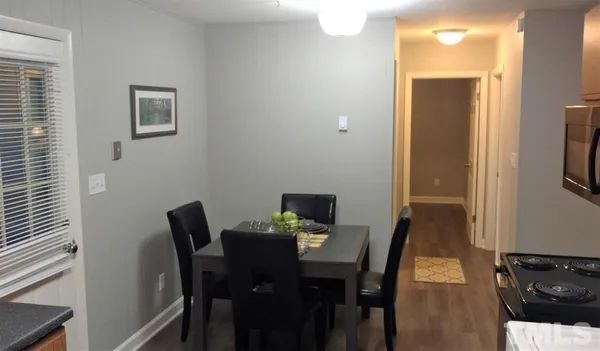 a view of a dining room with furniture
