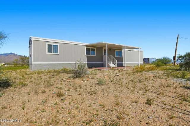 a house with trees in the background