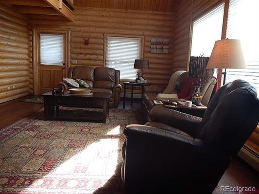 181 Doe Circle South Fork, CO 81154 - Photo 20 of 35 a living room with furniture and a lamp