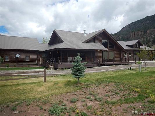 181 Doe Circle South Fork, CO 81154 - Photo 2 of 35 a view of a house with a yard