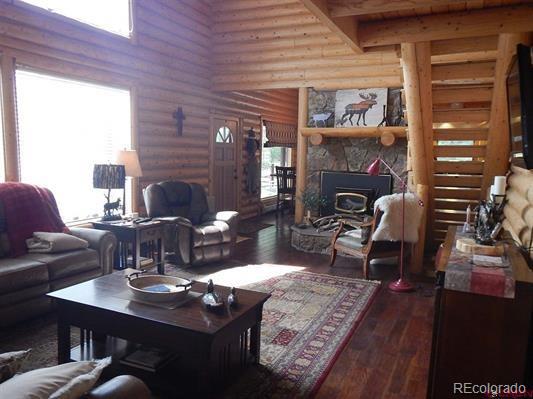 181 Doe Circle South Fork, CO 81154 - Photo 21 of 35 a living room with furniture and a fireplace