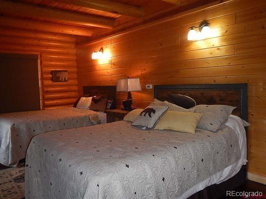 181 Doe Circle South Fork, CO 81154 - Photo 31 of 35 a bedroom with two beds and a window