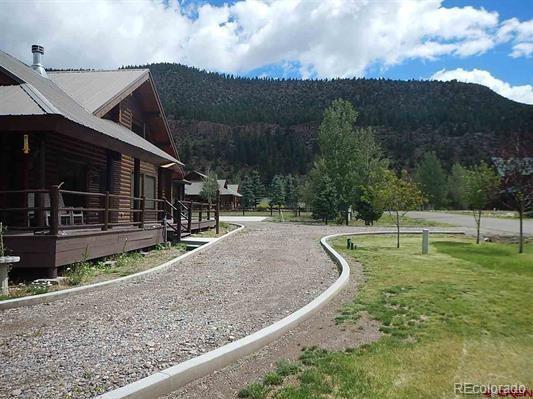 181 Doe Circle South Fork, CO 81154 - Photo 4 of 35 a view of a house with backyard
