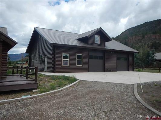 181 Doe Circle South Fork, CO 81154 - Photo 5 of 35 a front view of a house with garage