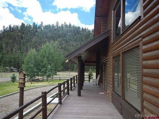 181 Doe Circle South Fork, CO 81154 - Photo 10 of 35 a view of a house with backyard and trees