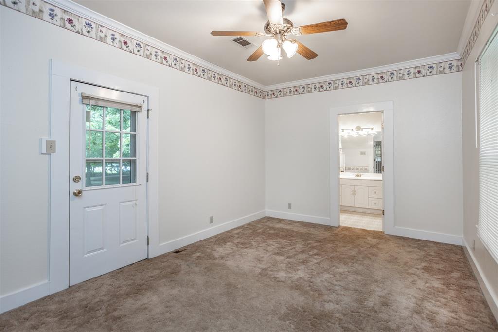 206 Ritchey Street Gainesville, TX 76240 - Photo 19 of 36 a view of an empty room with a window