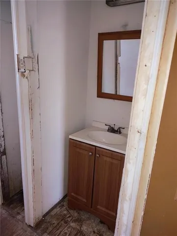 a bathroom with a sink a mirror and shower