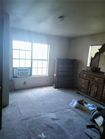 a view of room with workspace and windows