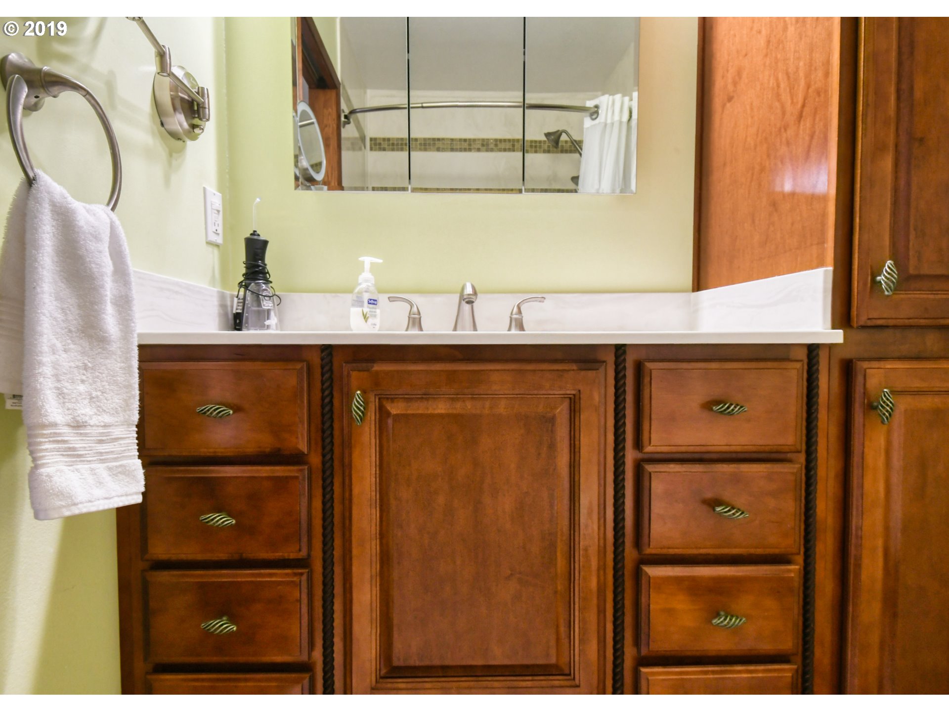 1610 Southwest 18th Street Pendleton, OR 97801 - Photo 12 of 32 a bathroom with a sink a mirror and shower