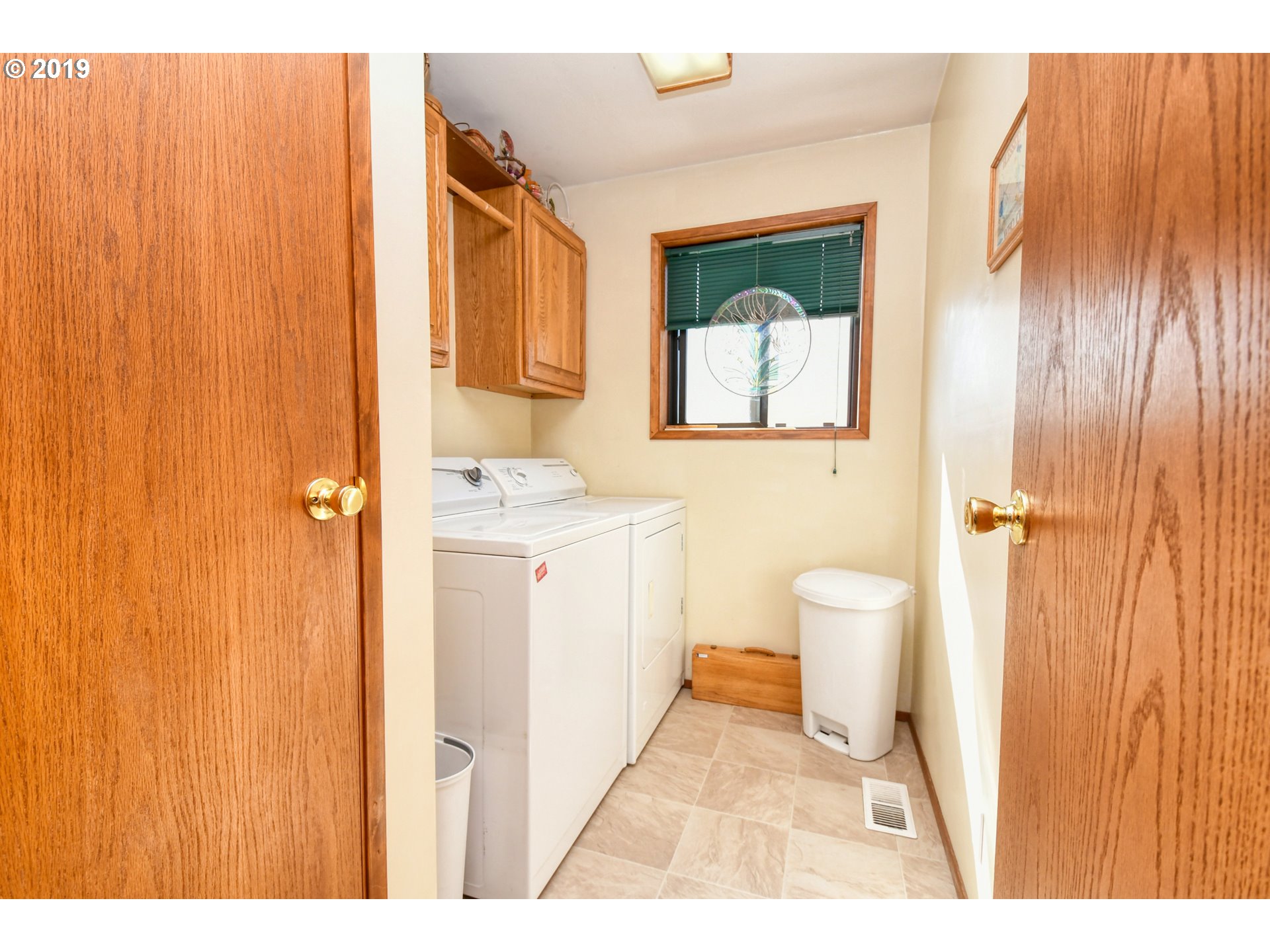 1610 Southwest 18th Street Pendleton, OR 97801 - Photo 13 of 32 a bathroom with a sink a toilet and shower curtain