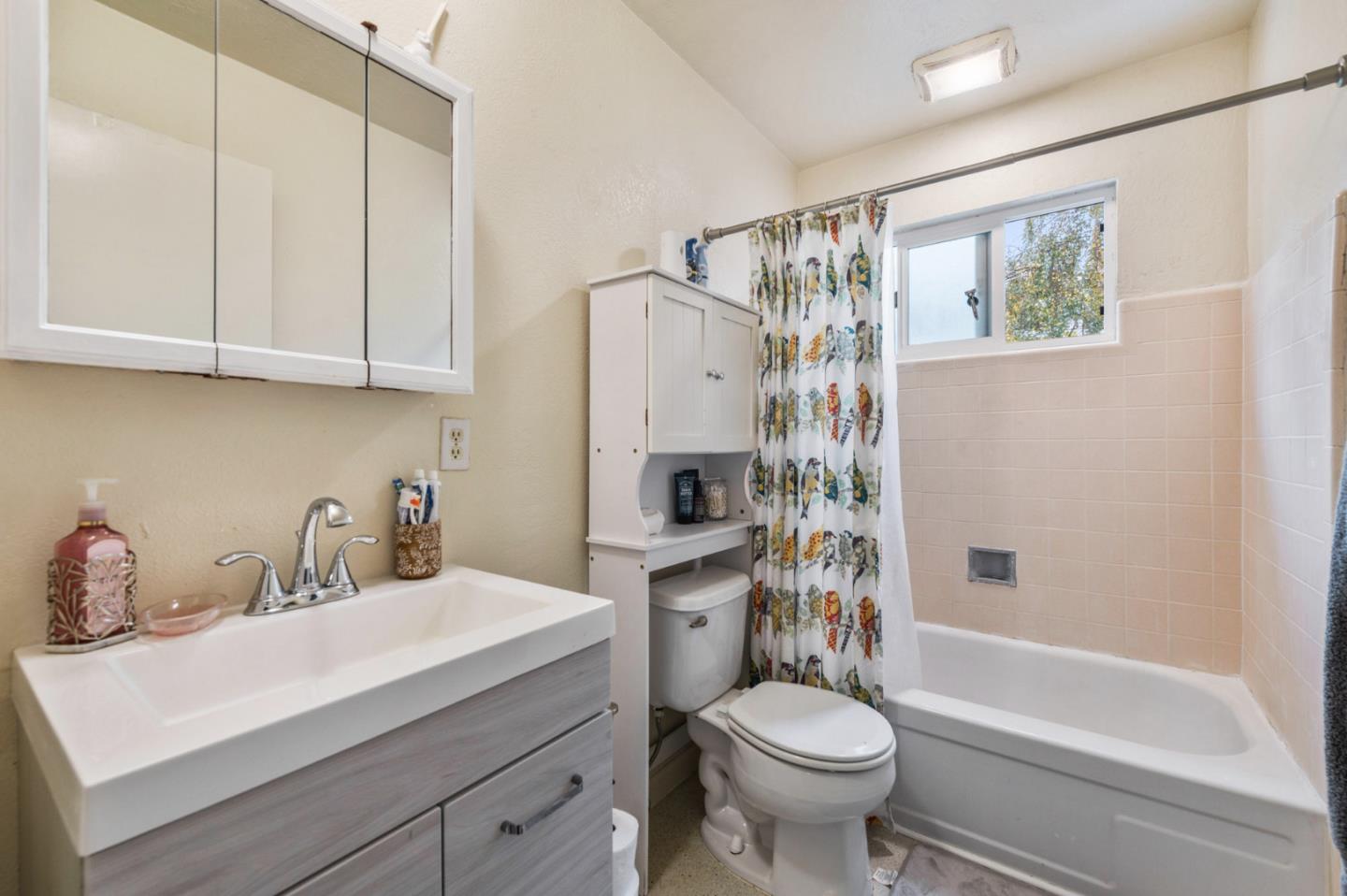 1830 48th Avenue Capitola, CA 95010 - Photo 16 of 32 a bathroom with a sink a toilet and shower
