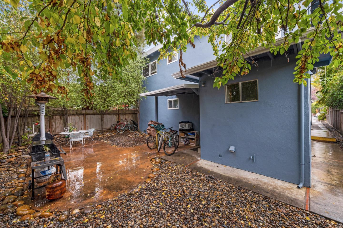 1830 48th Avenue Capitola, CA 95010 - Photo 18 of 32 a view of a patio with table and chairs and potted plants