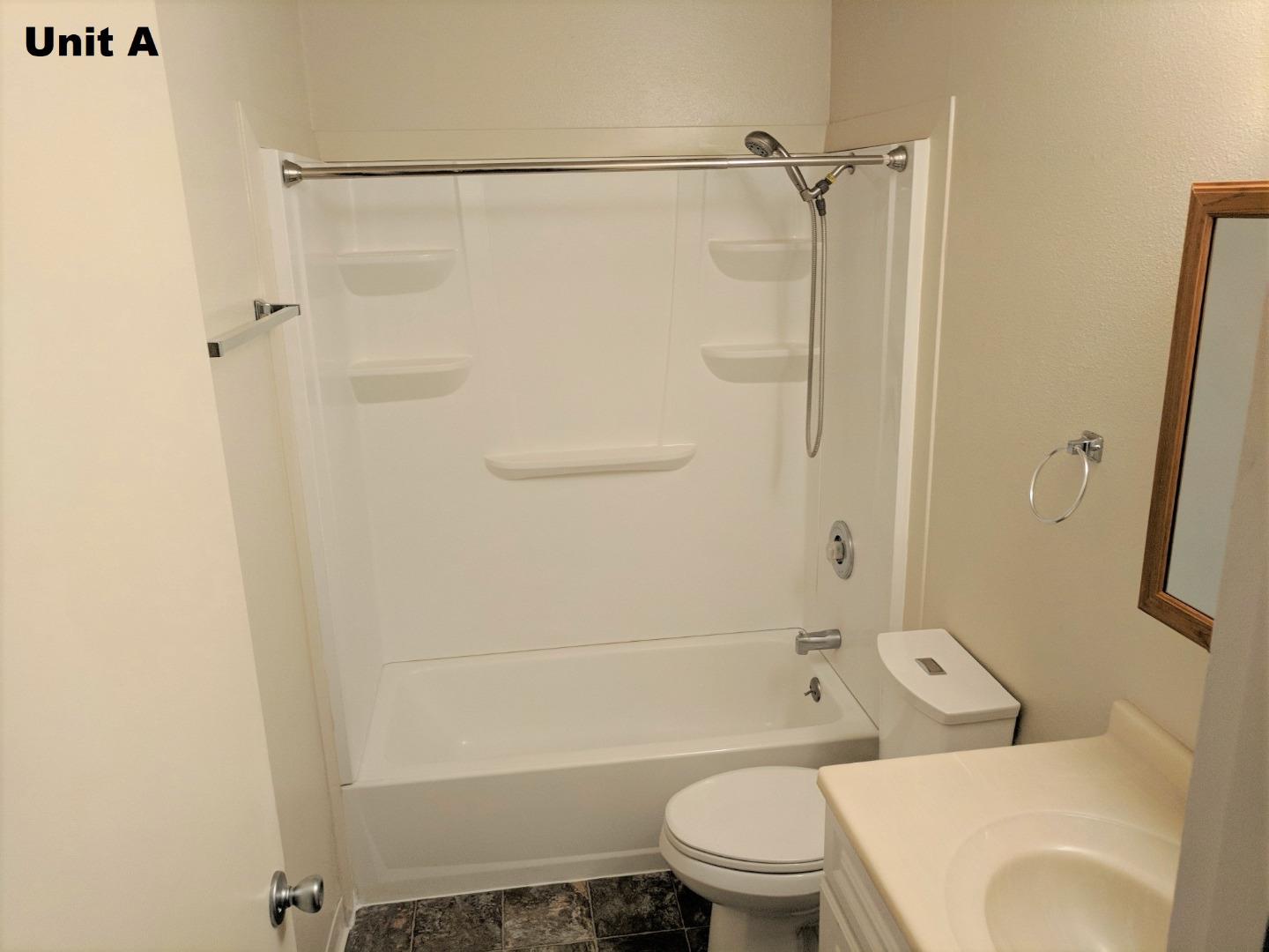 1830 48th Avenue Capitola, CA 95010 - Photo 24 of 32 a bathroom with a toilet and a shower