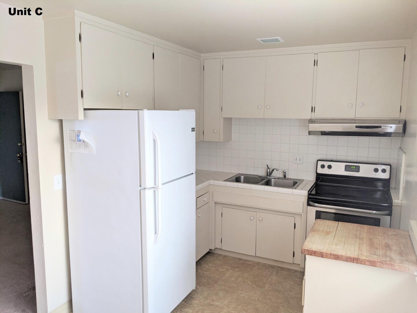 1830 48th Avenue Capitola, CA 95010 - Photo 28 of 32 a kitchen with a sink a stove and refrigerator
