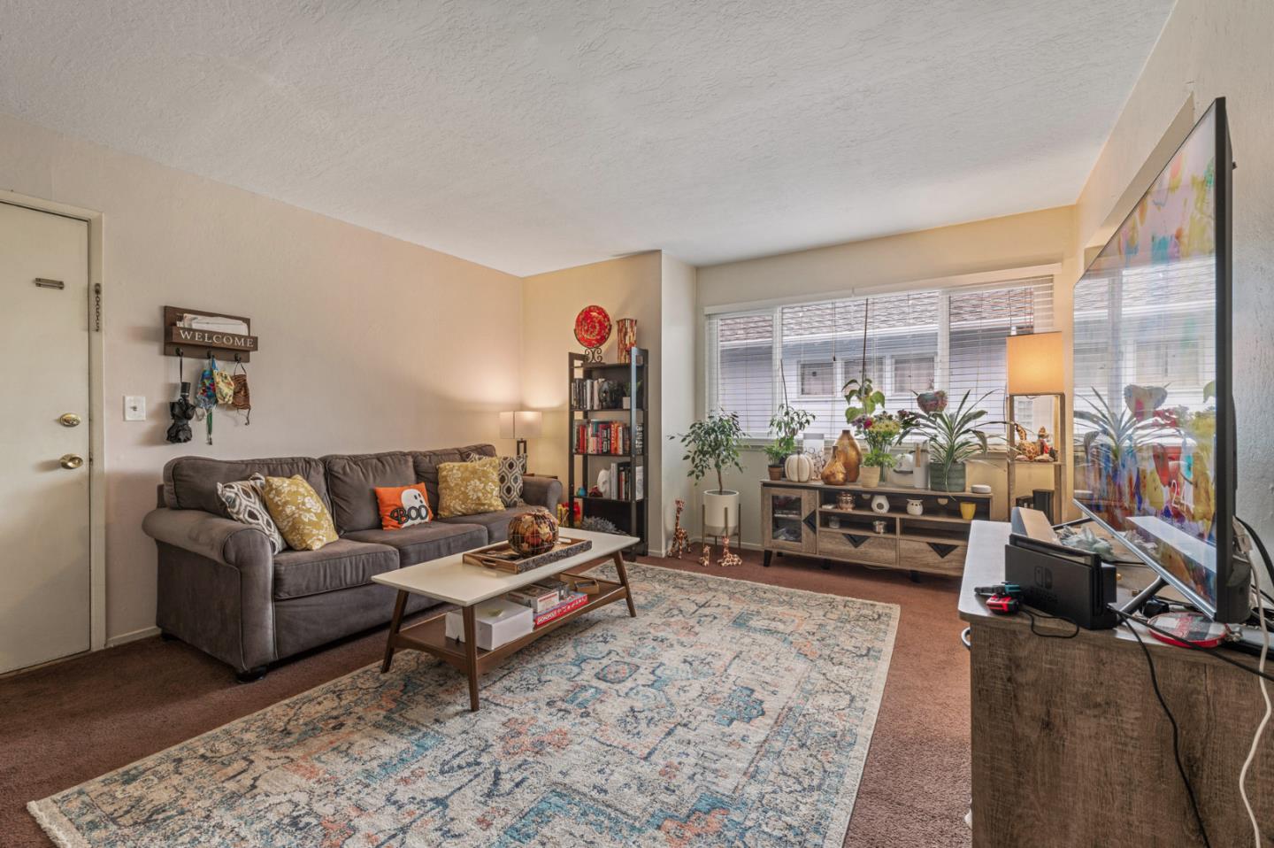 1830 48th Avenue Capitola, CA 95010 - Photo 5 of 32 a living room with furniture and a large window