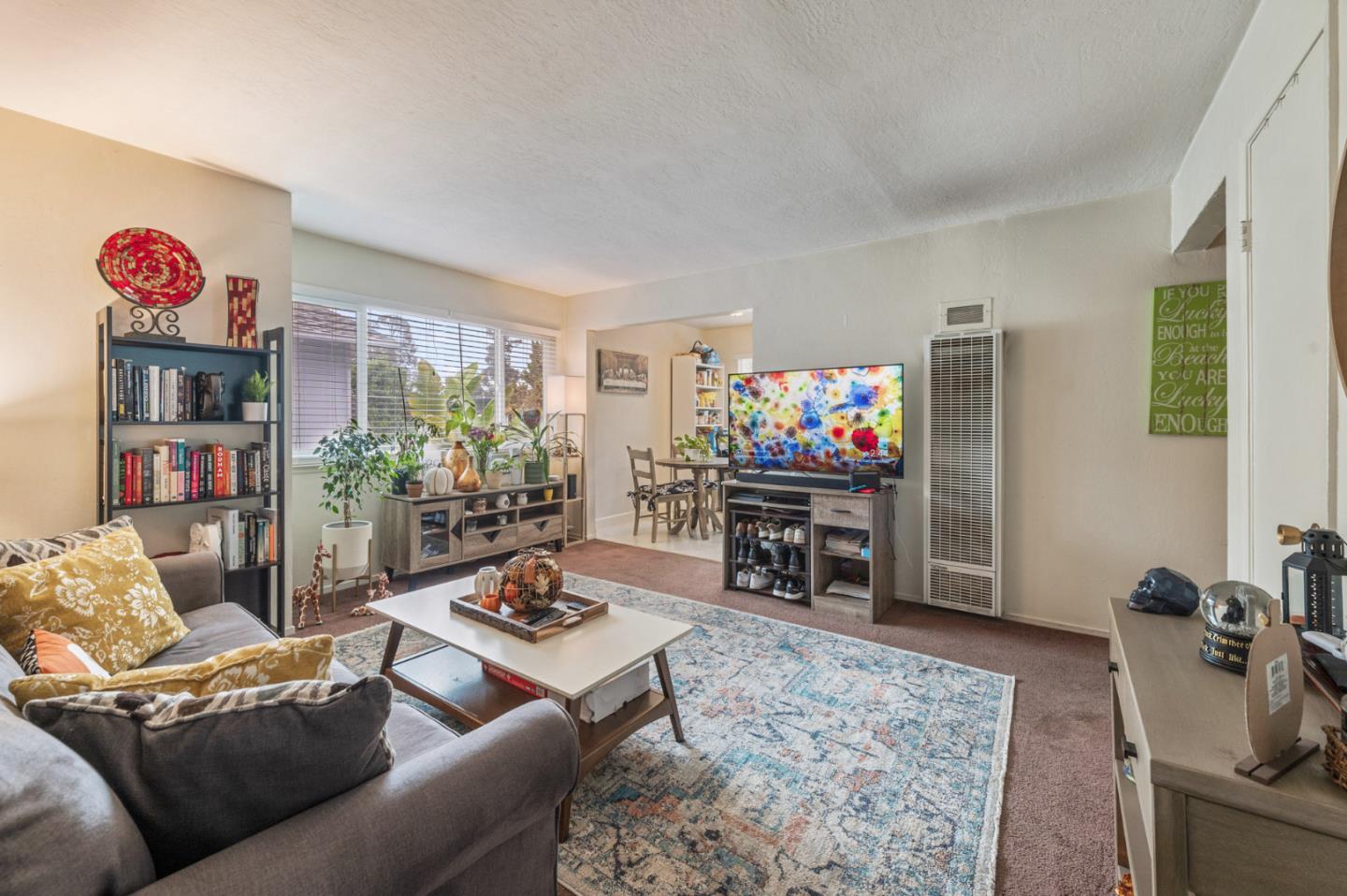 1830 48th Avenue Capitola, CA 95010 - Photo 6 of 32 a living room with furniture and a flat screen tv